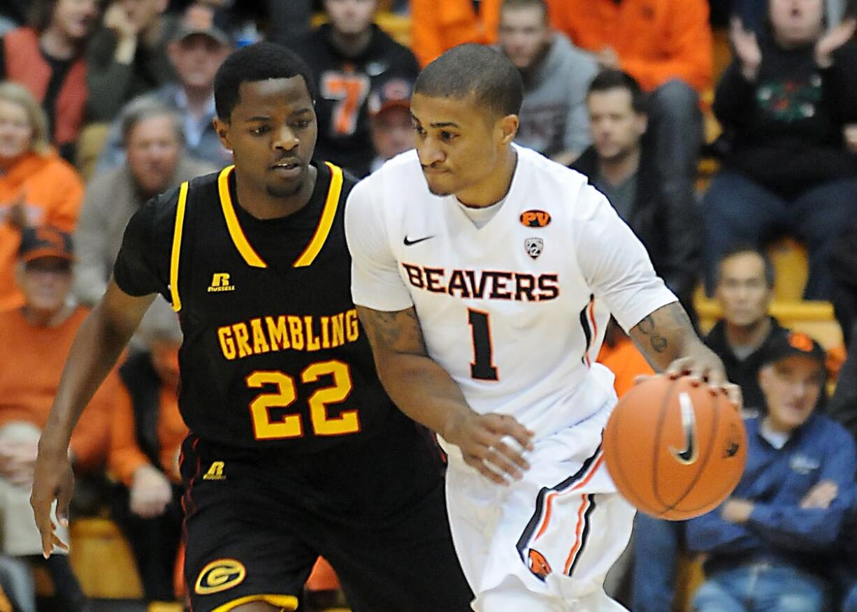 Oregon State's Gary Payton II (1) is the only player in Oregon State history to score a triple-double -- except for his father Gary Payton, who played for the Beavers from 1986-87 through 1989-90 before starting an NBA career.