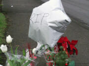 A memorial of flowers, candles, balloons and other tributes to Anneice Fich has grown during the past week at Northeast Third Avenue and Weir Street in Camas. Nearby on Dec. 23, Fich was pushing a stroller that held her great-grandson, Eduardo Herrera-Berra, 2, while crossing the street when she was hit by a vehicle. Fich, 66, died at the scene, while Herrera-Berra was hospitalized for injuries including broken ribs, a punctured lung and a fractured leg. He was released Dec.