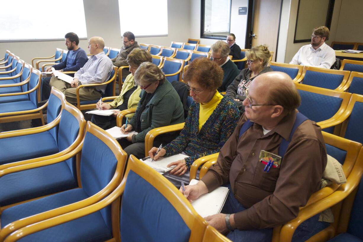 A group of Clark County residents attends an EFSEC board meeting Jan. 21 in Olympia. EFSEC is the state board that will forward a recommendation to the governor on whether or not to permit the Tesoro-Savage oil terminal at the Port of Vancouver.