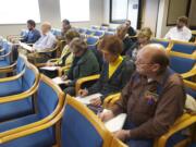 A group of Clark County residents attends an EFSEC board meeting Jan. 21 in Olympia. EFSEC is the state board that will forward a recommendation to the governor on whether or not to permit the Tesoro-Savage oil terminal at the Port of Vancouver.