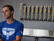 Co-owner Rob Ziebell offers a range of beers, all with running-related names, at Ghost Runners Brewery.