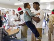 Tyrell Bennett, 23, embraces his son, Tyrell Bennett Jr., 3, Sunday at the Larch Corrections Center in Yacolt. The two hadn't seen each other for 16 months. &quot;If only I knew then what I know now,&quot; he said.