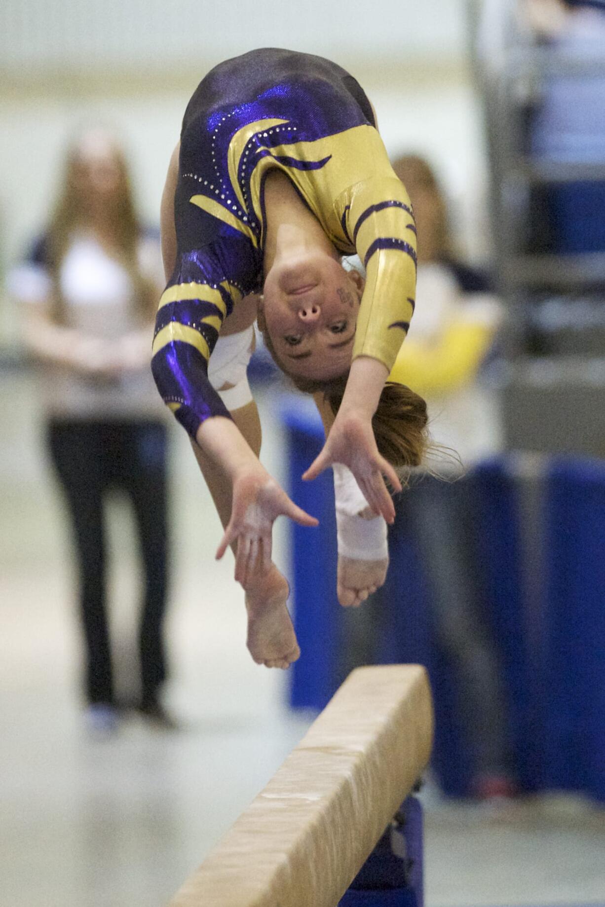 Columbia River gymnast Kenzie Moxley competes on the beam in the 3A individual event finals at the State Gymnastics meet in Tacoma, Saturday, February 22, 2014.