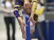 Columbia River gymnast Kenzie Moxley competes on the beam in the 3A individual event finals at the State Gymnastics meet in Tacoma, Saturday, February 22, 2014.