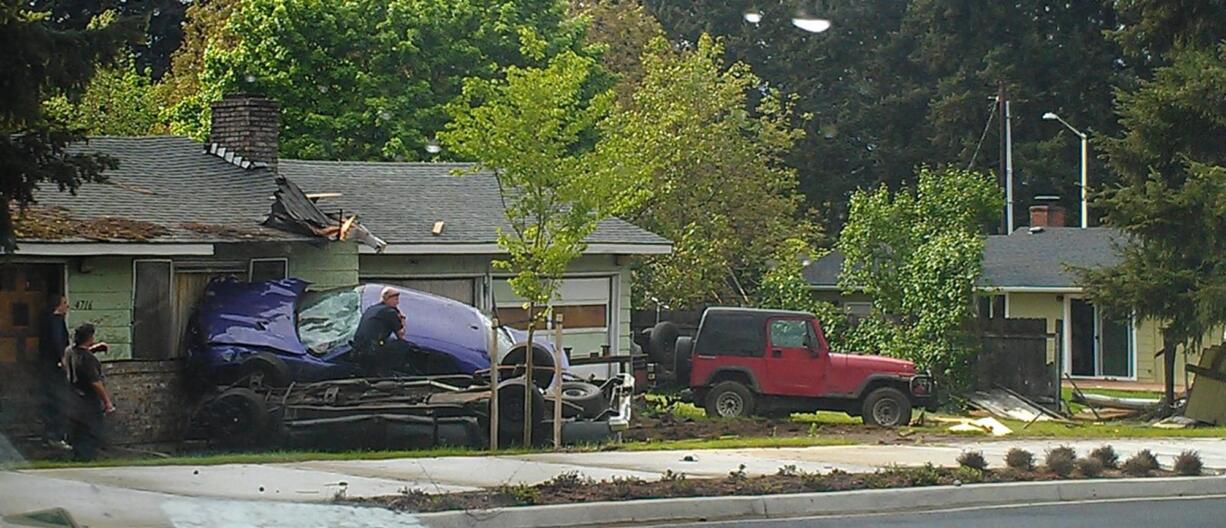 A driver was injured Sunday when her car smashed into a parked car and a house at 4719 N.E. 137th Ave. in Vancouver. Police said she likely experienced a medical problem just before the crash.