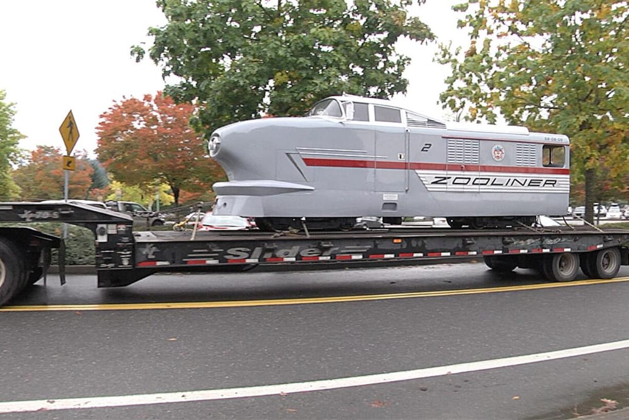 Two of the Oregon Zoo???s historic train cars returned to the zoo on Thursday following repairs and refurbishing over the summer by Pacific Power Group in Ridgefield.