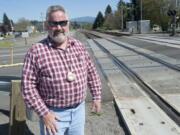 Washougal Mayor Sean Guard pauses at the railroad tracks, near his downtown Washougal campsite.