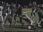 Mountain View's Preston Jones (#2) scores a touchdown against Union's Keithen Shepard (#3) during a high school football game in Vancouver Wa., Friday Sept 18, 2015.