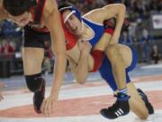 Mountain View 113-pounder Benjamin Dixon, in blue, was one of four Thunder wrestlers to win quarterfinal matches Friday.