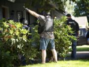 The Clark-Vancouver Regional Drug Task Force executes a search warrant at a suspected drug house Wednesday in Felida.