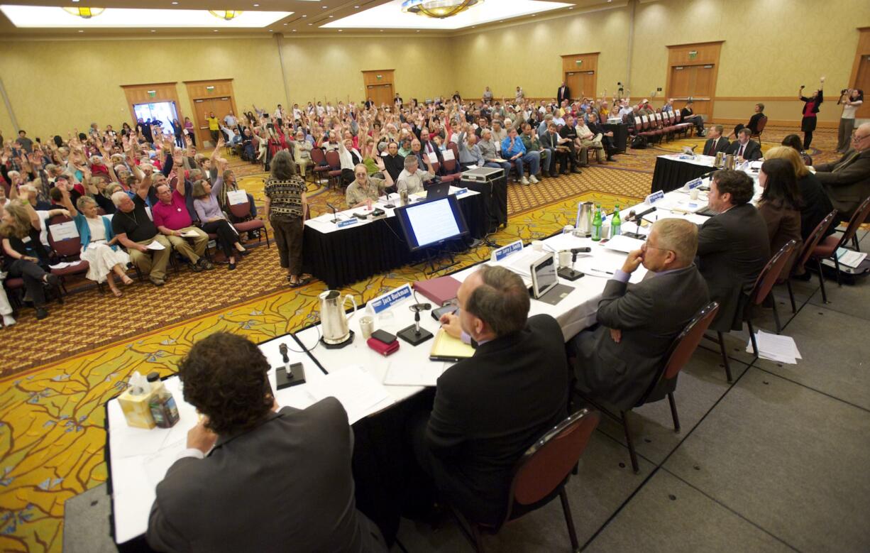 Vancouver resident Cathryn Chudy asks for a show of hands of those who oppose the Tesoro-Savage oil facility as she testifies in front of the Vancouver City Council during a meeting Monday at the Hilton Vancouver Washington.