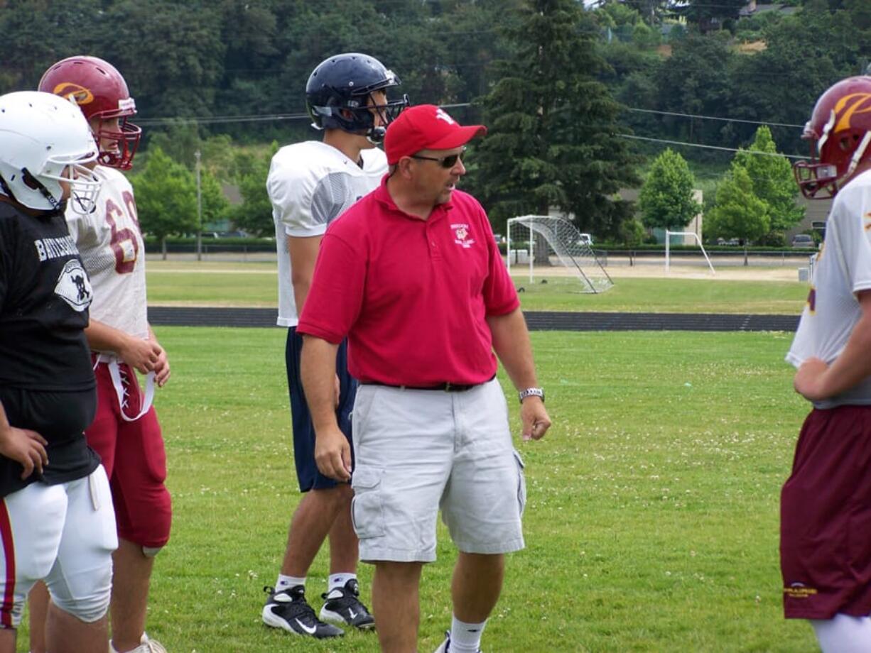 Cal Szueber, center, talks to players before he 2009 Shriner's Freedom Bowl Classic.