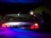 Washington State Patrol Sgt. Grant Clark makes a traffic stop on Interstate 5 northbound as part of the Night of 1000 Stars impaired driver emphasis patrol Friday.