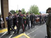 The procession makes its way into the First Church of God on Monday during the funeral for Vancouver Fire Capt.