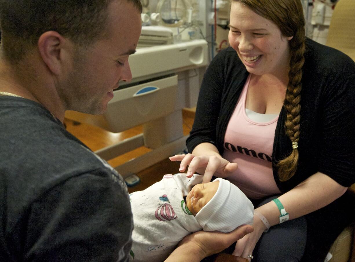 Carlos Maldonado, a U.S. Army helicopter mechanic stationed in Germany, met his newborn son, Romeo, for the first time Wednesday.