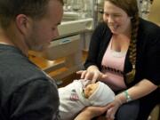 Carlos Maldonado, a U.S. Army helicopter mechanic stationed in Germany, met his newborn son, Romeo, for the first time Wednesday.