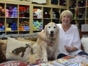 Jennifer Powell, with her dog, Bentley, at her store Wooly Wooly Wag Tails Yarn in Washougal.