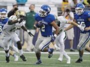 Mountain View running back Preston Jones (2) breaks tackles as the rushes for 120 yards on 18 carries against Auburn in  2015 Emerald City Kickoff Classic at Husky Stadium.  The Thunder beat the Trojans 32-21.