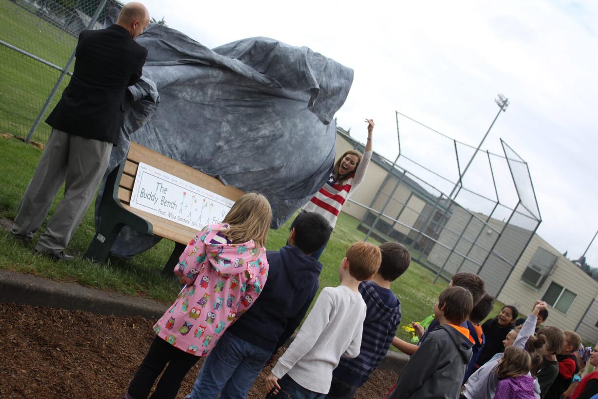 Woodland: Woodland Primary School's new &quot;Buddy Bench&quot; is unveiled during a ceremony June 13. The idea behind the bench, created with input and fundraising from third-graders, is to help eliminate loneliness in the playground.