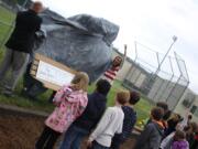 Woodland: Woodland Primary School's new &quot;Buddy Bench&quot; is unveiled during a ceremony June 13. The idea behind the bench, created with input and fundraising from third-graders, is to help eliminate loneliness in the playground.