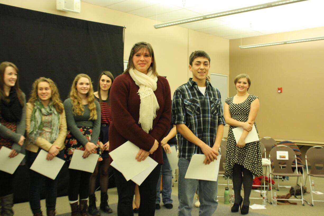 Vancouver School of Arts and Academics senior Elizabeth Williamson, center left, and Carlos Lehrke, center right, of Stevenson High School, won the regional Poetry Out Loud competition Feb. 4.