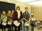 Vancouver School of Arts and Academics senior Elizabeth Williamson, center left, and Carlos Lehrke, center right, of Stevenson High School, won the regional Poetry Out Loud competition Feb. 4.