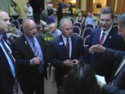 Sheriff candidates Shane Gardner, from left, Ed Owens, Chuck Atkins and John Graser go over the speaking rules prior to a forum Thursday in Vancouver.