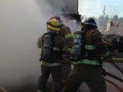 Battle Ground: Clark County Fire &amp; Rescue firefighters take part in a live fire training exercise on April 10 at 801 E.