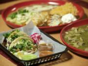 An enchilada sampler, background, chili verde, right, and street tacos (one steak and one chicken) are some of the menu items offered at Lindo Mexico Restaurant &amp; Cantina in Vancouver.