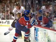 The Winterhawks' Alex Schoenborn check the Oil Kings' Blake Orban in the second period of game 5 of the WHL finals at the Moda Center on Friday May 9, 2014.