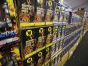 Workers set up the Bomber Brothers firework tent at 78th Street and Hwy. 99, Tuesday, June 24, 2014.