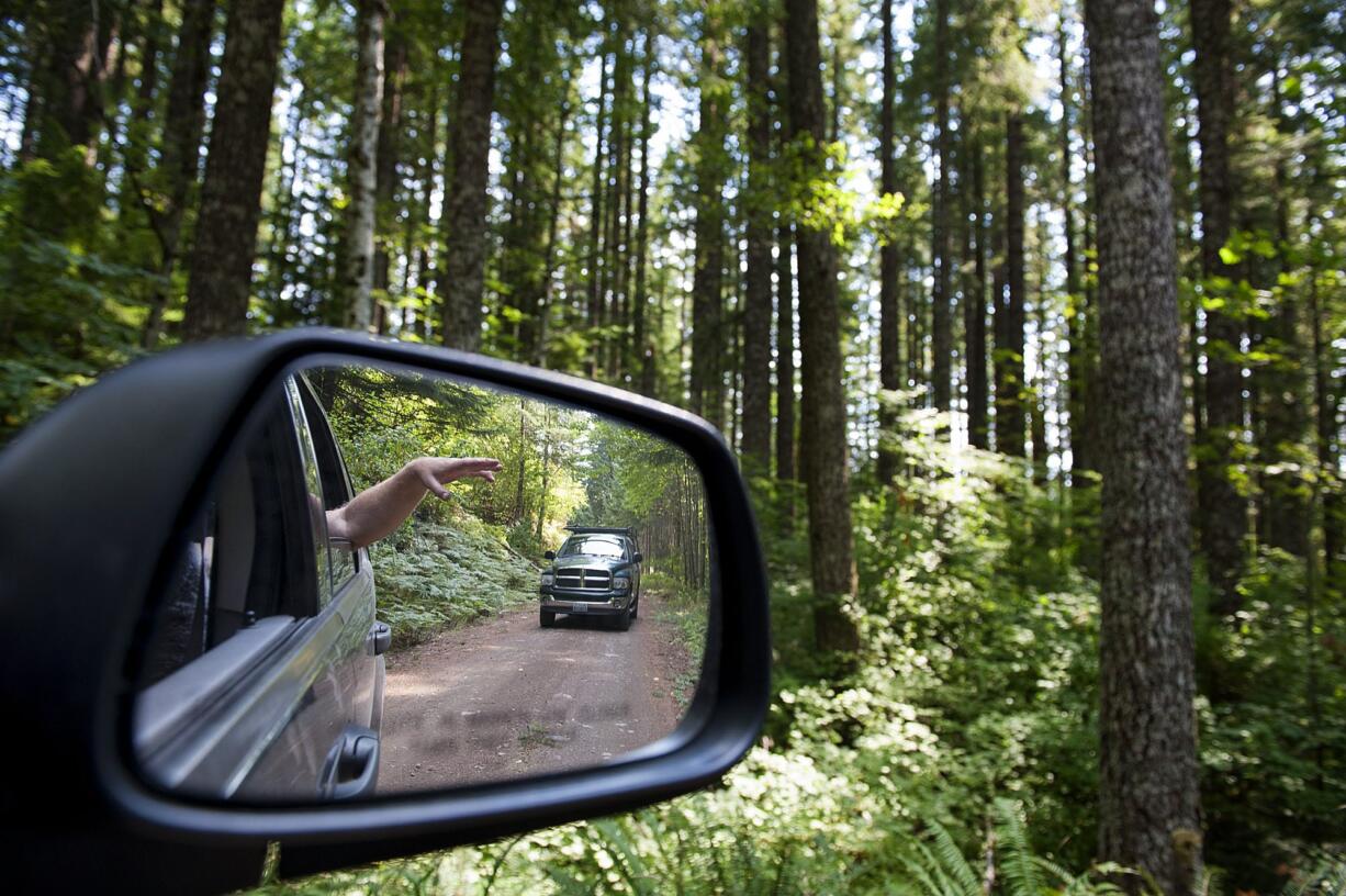 Members of Saving Skamania County tour land north of Stevenson including dispersal and foraging habitat for the spotted owl Friday afternoon, Sept. 11, 2015.