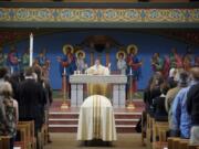 The Rev. Gary Lazzeroni of St. Joseph Catholic Church celebrates a memorial Mass on Tuesday for Vancouver police Sgt.