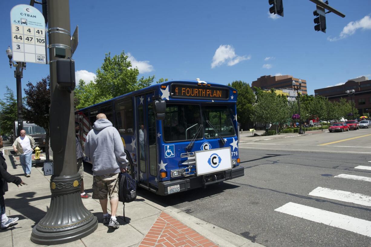 C-Tran's No. 4 bus picks up passengers at Seventh and Washington streets in downtown Vancouver near Turtle Place plaza this week.