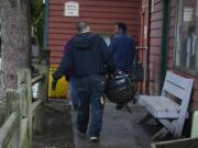 Courtyard Village Apartments residents on Dec. 10 started cleaning up the grounds and removing everything that had been left outside, including personal possessions such as a barbecue grill, after residents were given notice to vacate. The Vancouver City Council unanimously approved three ordinances Monday night designed to protect vulnerable, low-income renters. The ordinances will give renters more time to find new housing when told to vacate or told that rent is increasing, and would prevent landlords from refusing to rent to people based on their source of income.