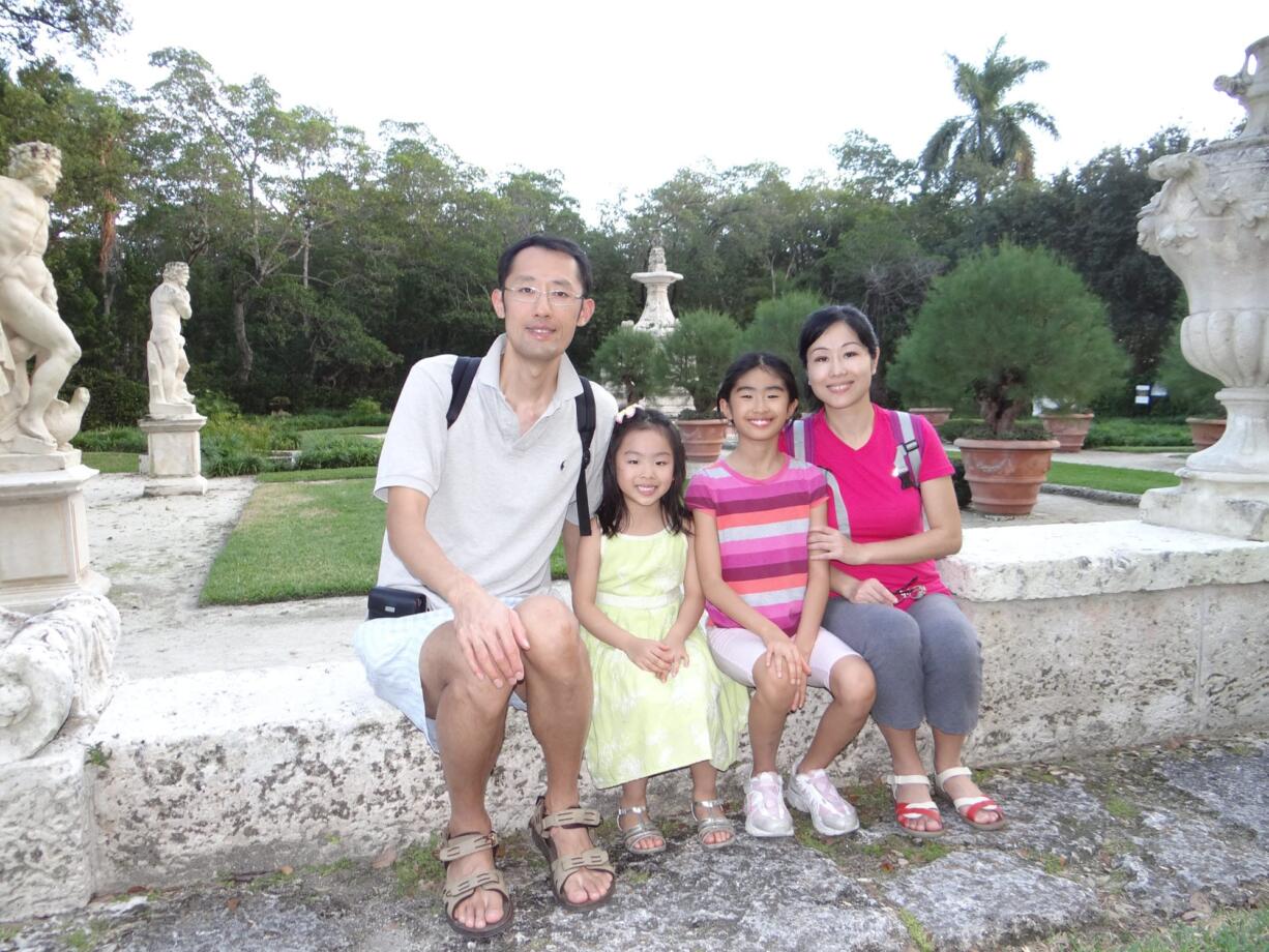 Roger, from left, 6-year-old Jade, 8-year-old Joy and Li Xu Young recently visited the Vizcaya Museum and Gardens in Miami.