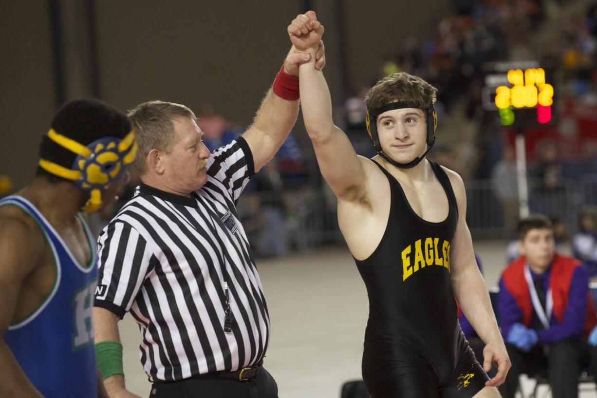 Hudson's Bay wrestler Gunnar Metzger beats Malik Haythorne, from Hazen, to win the Class 3A 152-pound championship at the Tacoma Dome.