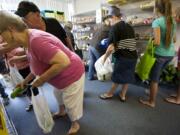 By code, 10 people at one time are all that's allowed inside the shopping area at the North County Community Food Bank in Battle Ground.