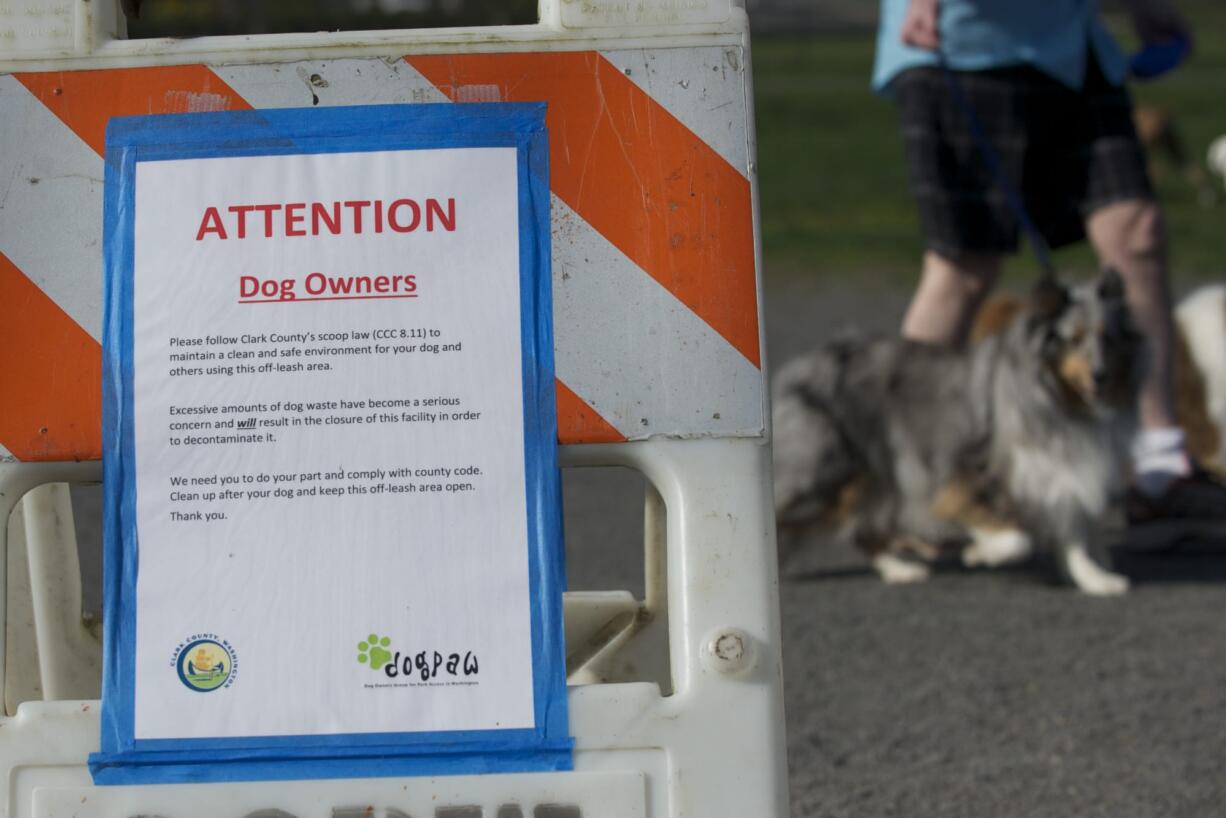 Signs tell dog owners to pick up after their pets, but dog waste at the park remains a problem.