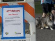 Signs tell dog owners to pick up after their pets, but dog waste at the park remains a problem.