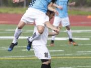 Vancouver's Bryanth Garcia-Junco heads ball over Westsound's Cameron Stone (10) during Sunday's 4-0 Vancouver victory.