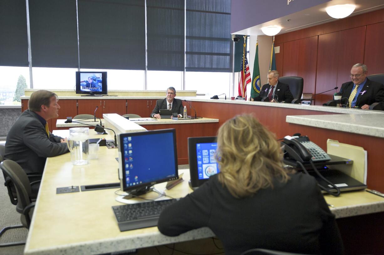 County Commissioners Tom Mielke and David Madore interview Craig Pridemore for the vacant District 3 seat Tuesday. After three hours of interviews, the commissioners entered a closed executive session.