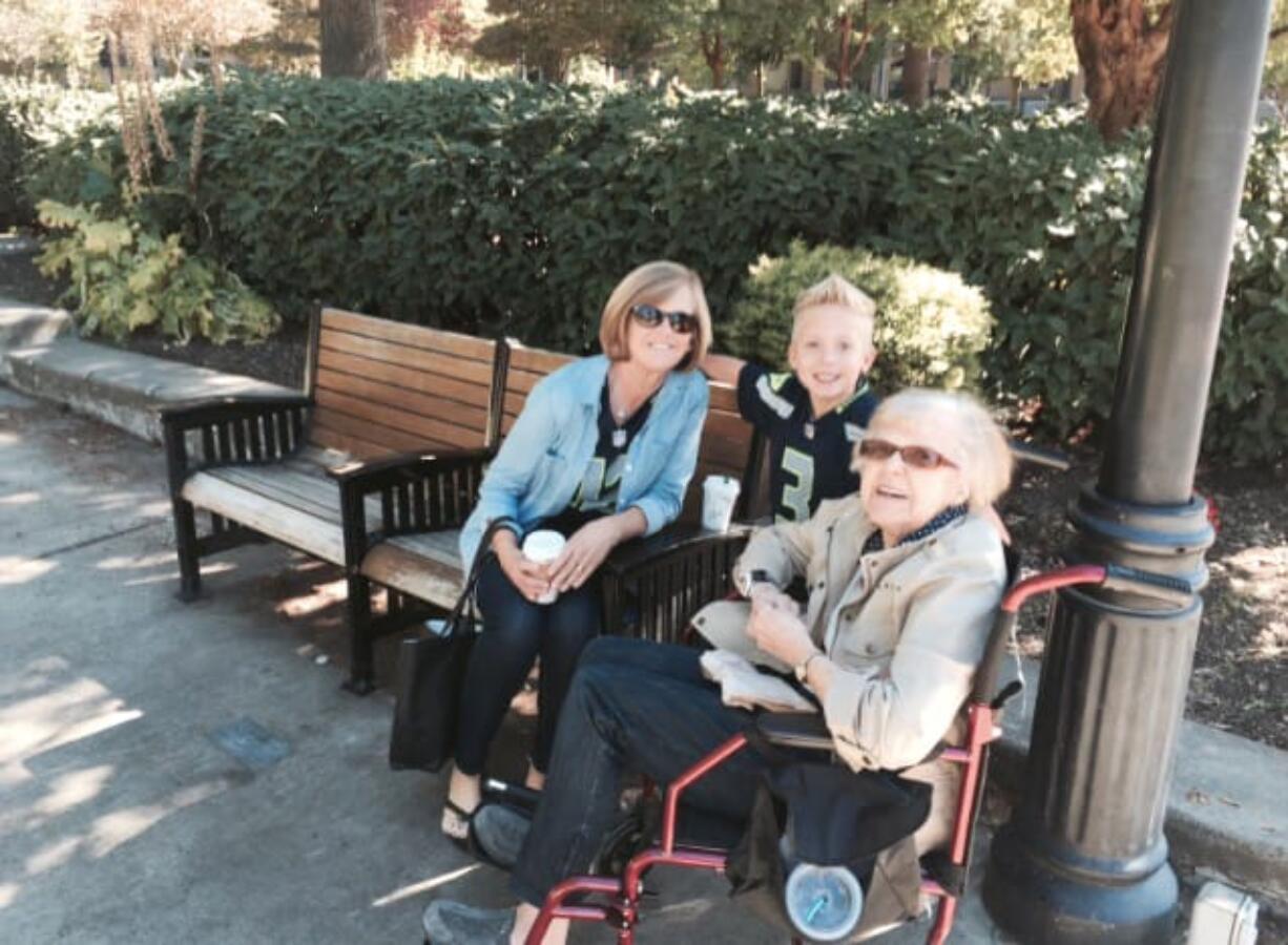 The family of the late Donald Jarosek -- from left, daughter Diane Sanders, grandson Crue Sanders, 5, and widow Vivian Jarosek -- gather at Esther Short Park in Vancouver on Sunday.