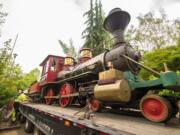 The Oregon Zoo's Centennial steam locomotive arrives Monday at Pacific Power Group headquarters in Ridgefield.