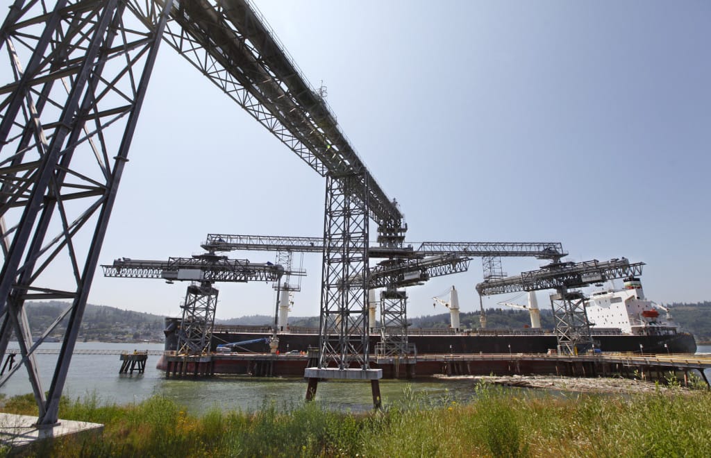 A grain ship loads at the EGT dock at the Port of Longview.