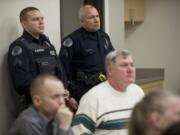 Cpl. Neil Martin, left, and Cpl. Jim Burgara attend a meeting of the Vancouver neighborhood alliance at the VPD East Precinct.