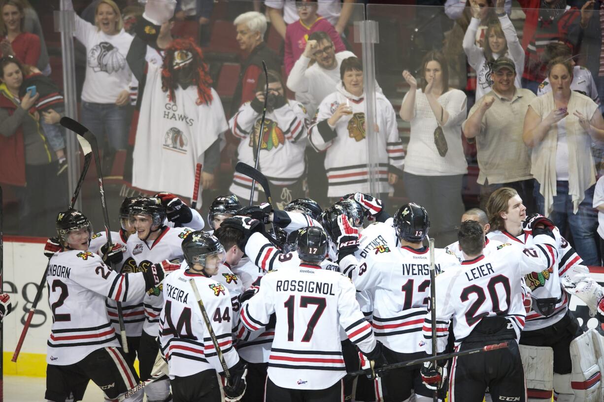 Winterhawks celebrate their 4-3 victory over the Vancouver Giants in game one of their best of seven series at the Moda Center on Friday.