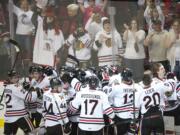 Winterhawks celebrate their 4-3 victory over the Vancouver Giants in game one of their best of seven series at the Moda Center on Friday.