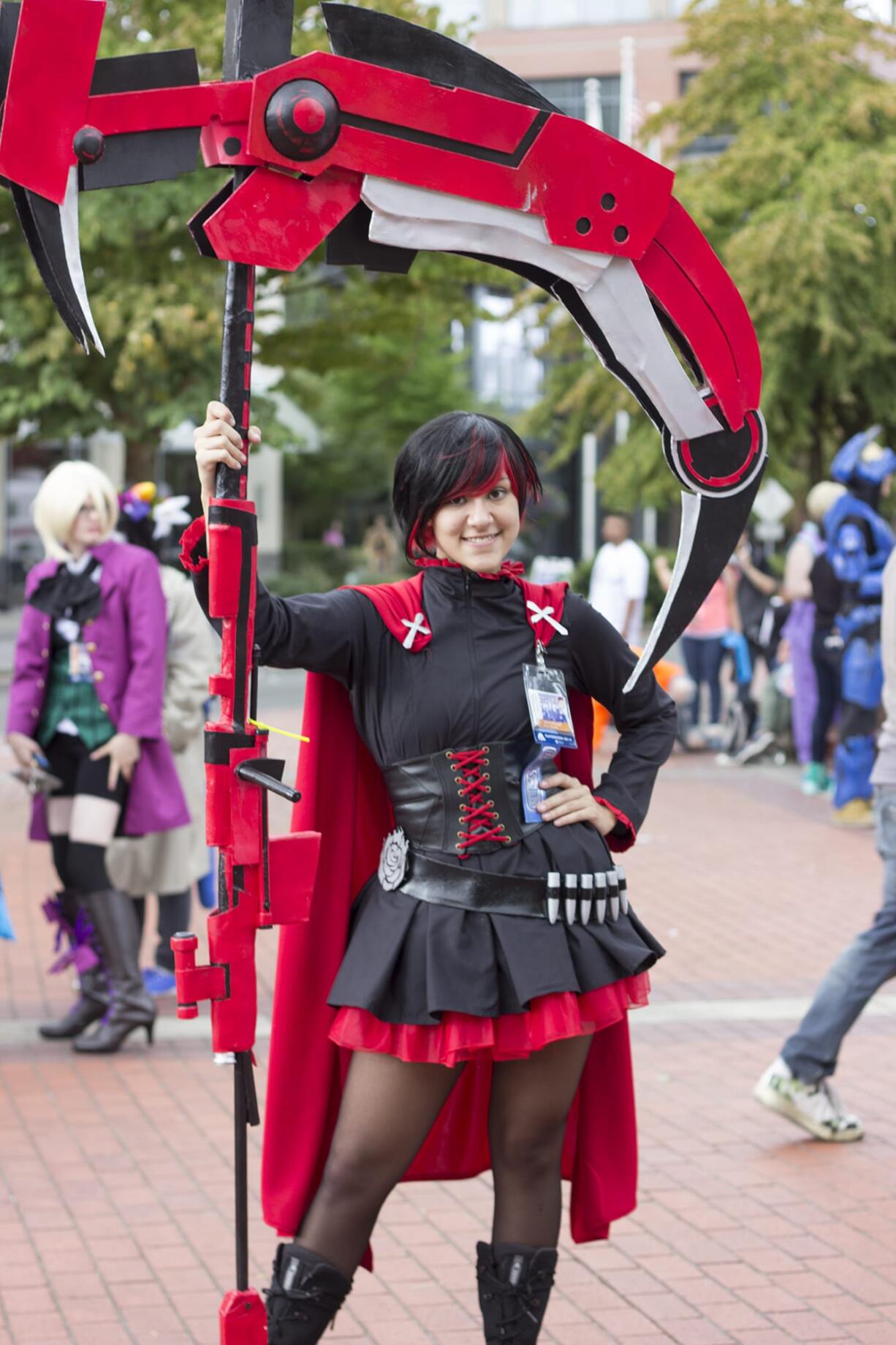 Kait Baird, 16, of Portland wields the scythe she made for her Ruby Rose costume. The character is from the American animated web series RWBY.