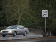 Despite posted 25 mph speed limits, vehicles are known to speed along McGillivray Boulevard, above, a residential street, but also a major arterial, in east Vancouver.